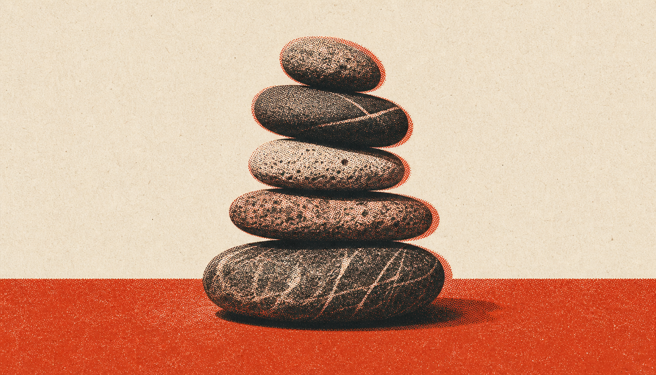 A balanced stone cairn symbolizing lessons from a premeditatio malorum practice